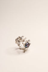 Silver ring with a small chrome pearl