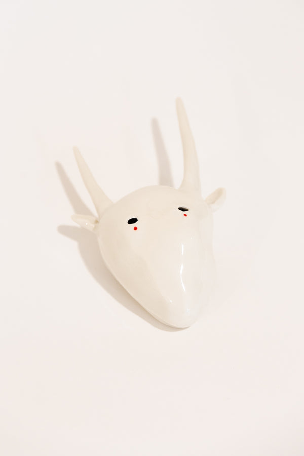 Porcelain figure with long horns