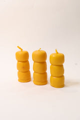 three wax balls stacked candle