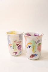 two colorful hand painted face cups